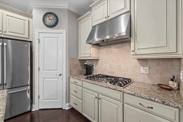 12606 Fontana Loop, Bradenton, FL 34211 - kitchen with appliances with stainless steel finishes, under cabinet range hood, crown molding, backsplash, and light stone counters
