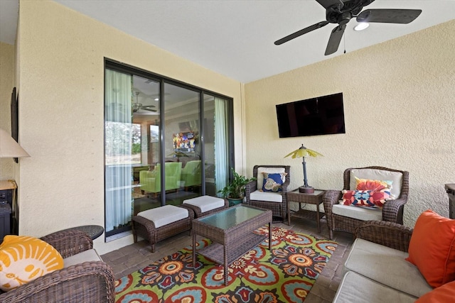 12606 Fontana Loop, Bradenton, FL 34211 - living area featuring a textured wall and ceiling fan