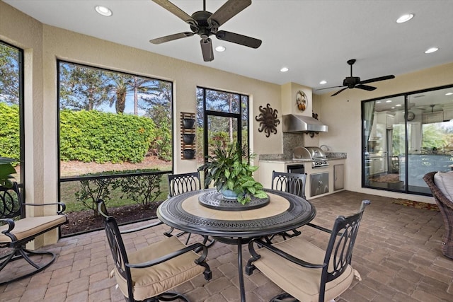 12606 Fontana Loop, Bradenton, FL 34211 - sunroom featuring a ceiling fan, exterior kitchen, and healthy amount of natural light