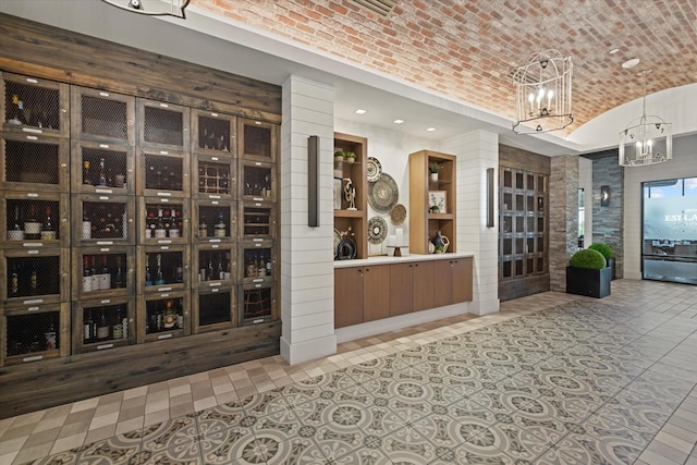 12606 Fontana Loop, Bradenton, FL 34211 - wine area featuring brick ceiling, a chandelier, recessed lighting, tile patterned flooring, and lofted ceiling