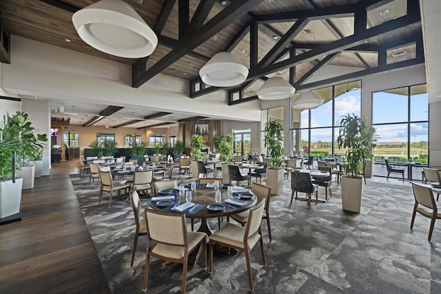 12606 Fontana Loop, Bradenton, FL 34211 - dining room featuring plenty of natural light, a wooden ceiling with exposed beams, and a towering ceiling