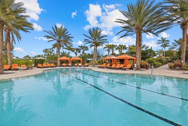 view of swimming pool featuring a gazebo and a patio area