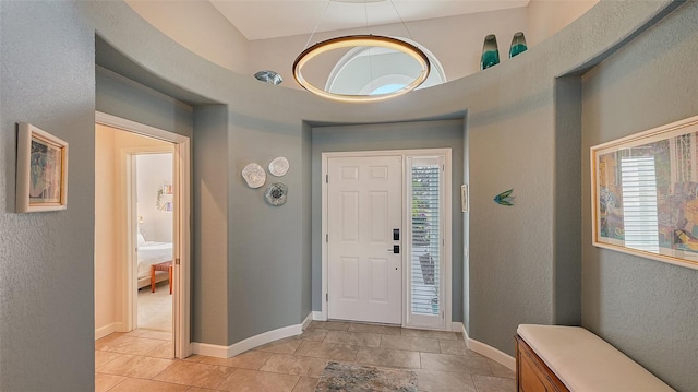 entrance foyer with light tile patterned floors