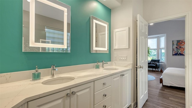 bathroom with vanity and wood-type flooring