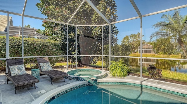 view of pool featuring an in ground hot tub, a lanai, a water view, and a patio