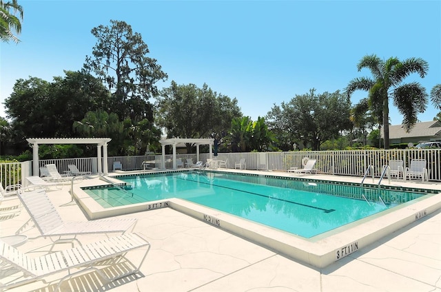 view of swimming pool with a patio and a pergola