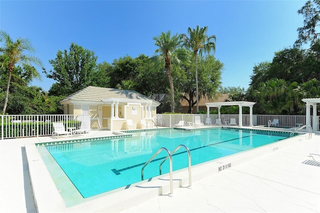 view of swimming pool with a pergola and a patio