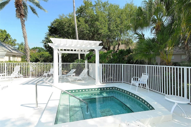 view of swimming pool with a hot tub and a pergola