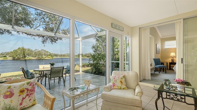 sunroom / solarium featuring a water view