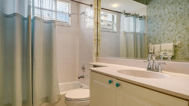 full bathroom featuring vanity, shower / bath combo, and toilet