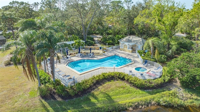 view of pool with a patio area and a hot tub