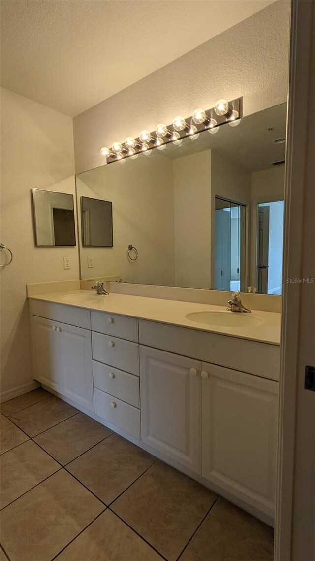 bathroom featuring tile patterned floors and vanity