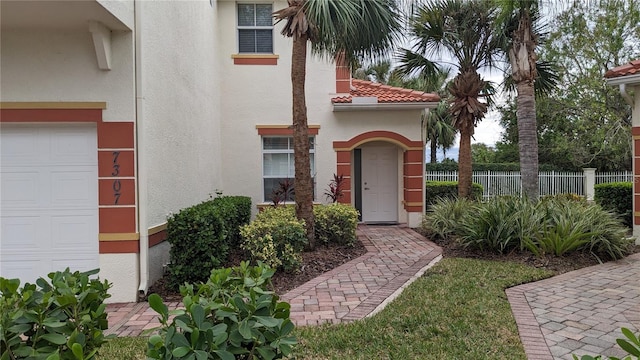 property entrance with a garage