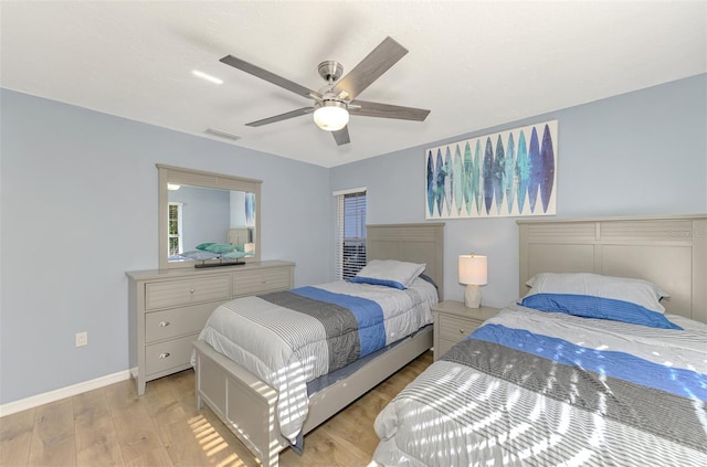 bedroom featuring ceiling fan and light hardwood / wood-style flooring