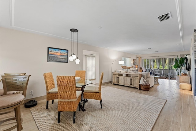 dining room with light hardwood / wood-style flooring