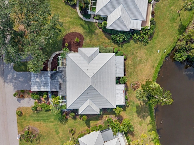 birds eye view of property featuring a water view