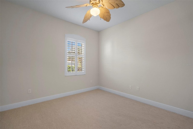 empty room with carpet flooring and ceiling fan