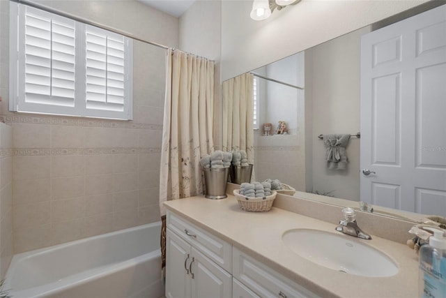 bathroom with vanity and shower / bath combo