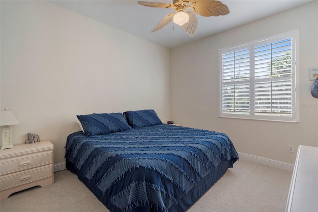 bedroom featuring light carpet and ceiling fan