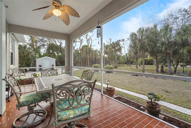 sunroom / solarium with ceiling fan