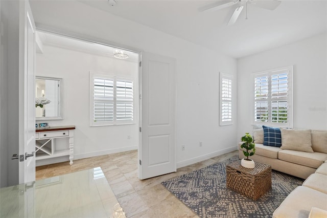 living room with light tile patterned floors and ceiling fan