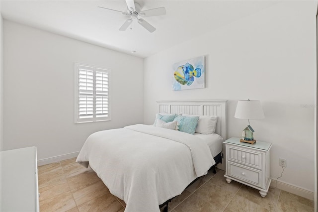 tiled bedroom with ceiling fan