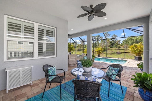 sunroom / solarium with a pool and ceiling fan