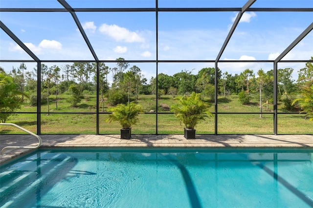 view of swimming pool with a lawn and glass enclosure