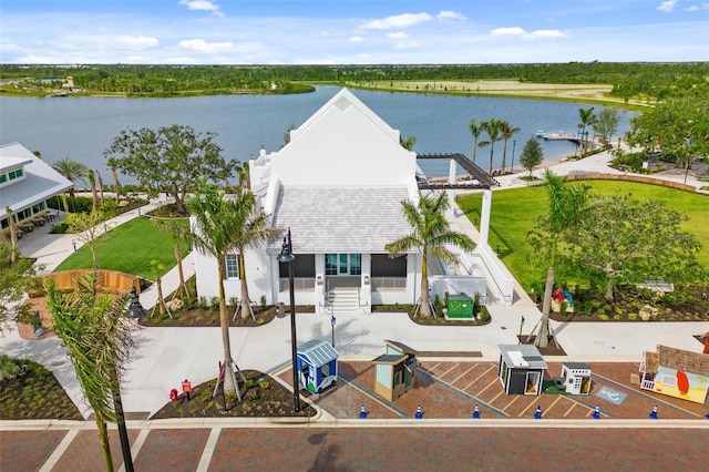 birds eye view of property with a water view