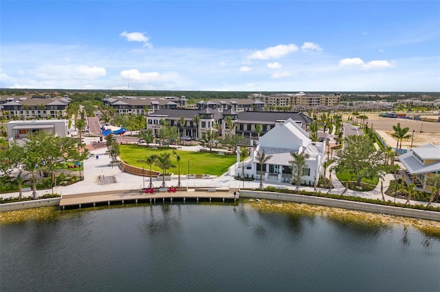 birds eye view of property with a water view