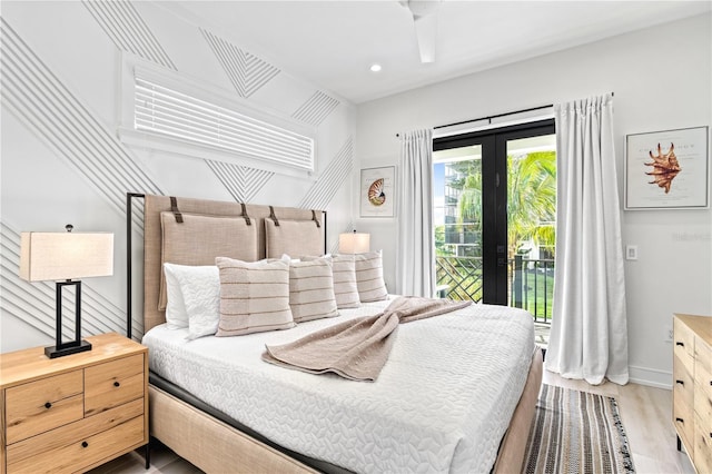 bedroom featuring access to exterior, french doors, and light hardwood / wood-style floors