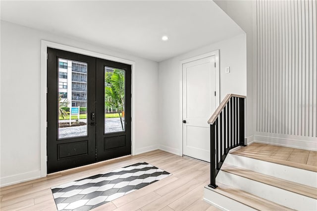 entryway featuring french doors and light hardwood / wood-style floors