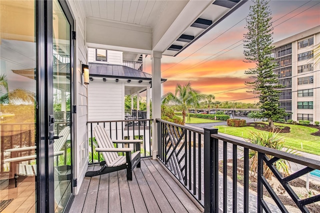 view of balcony at dusk