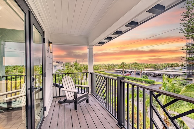 view of balcony at dusk