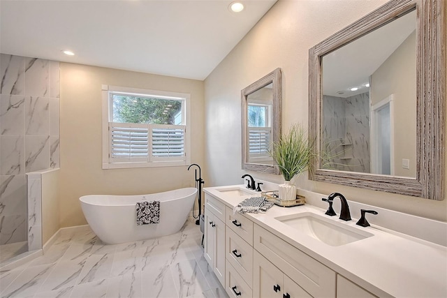 bathroom featuring vanity and separate shower and tub