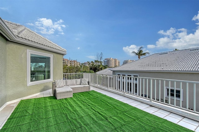 view of yard featuring a balcony and an outdoor hangout area