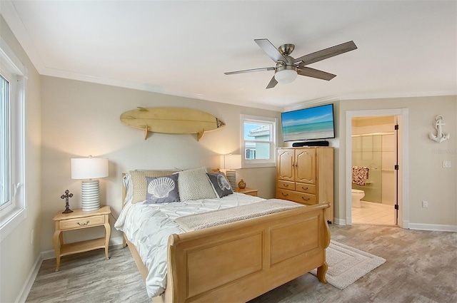 bedroom featuring connected bathroom, ceiling fan, hardwood / wood-style floors, and crown molding