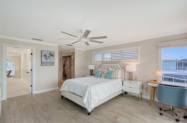 bedroom with ceiling fan, crown molding, and light wood-type flooring