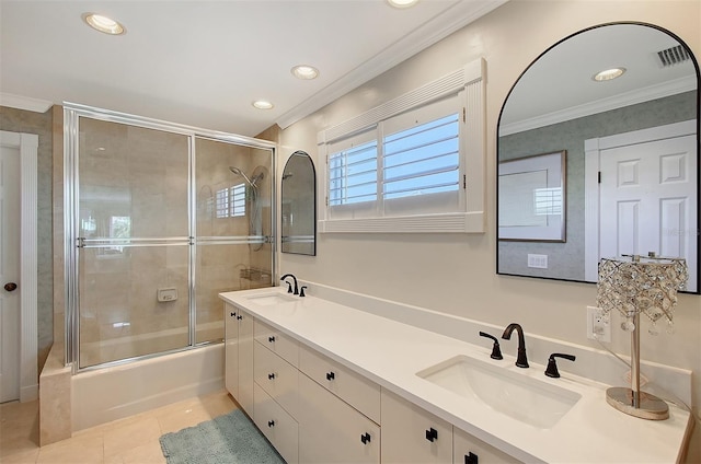 bathroom with tile patterned floors, vanity, enclosed tub / shower combo, and ornamental molding