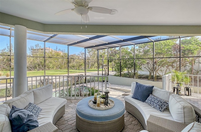 sunroom featuring ceiling fan