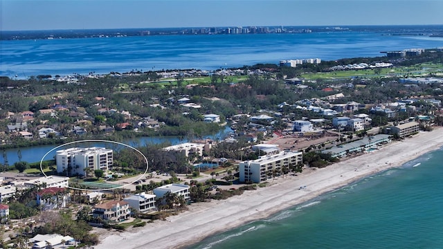 aerial view featuring a water view and a beach view