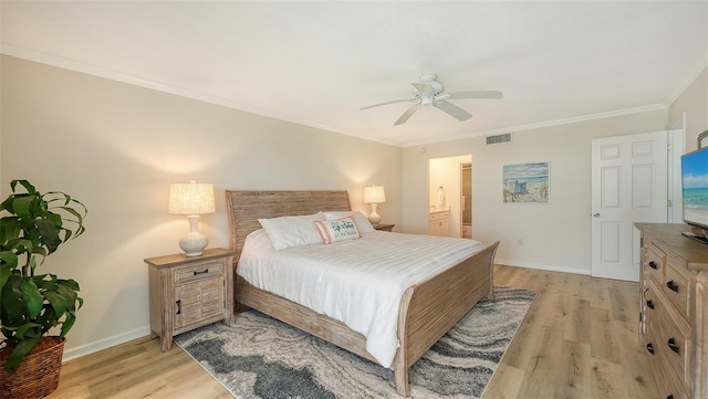 bedroom featuring light wood-type flooring, ceiling fan, and crown molding