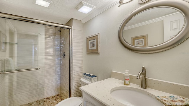 bathroom with walk in shower, vanity, ornamental molding, and toilet