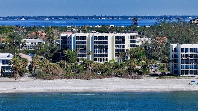 birds eye view of property featuring a water view and a view of the beach