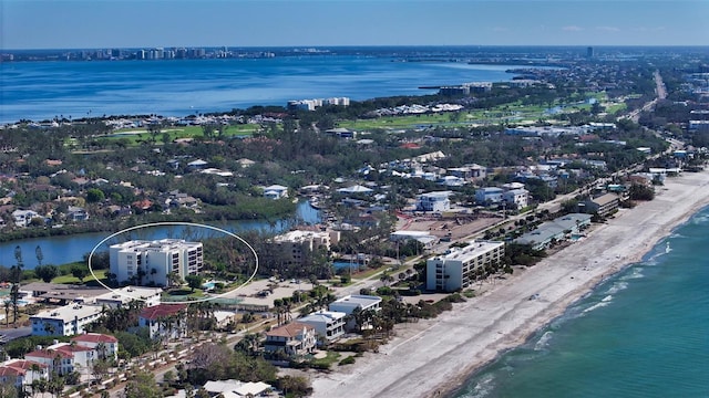 aerial view with a water view and a view of the beach