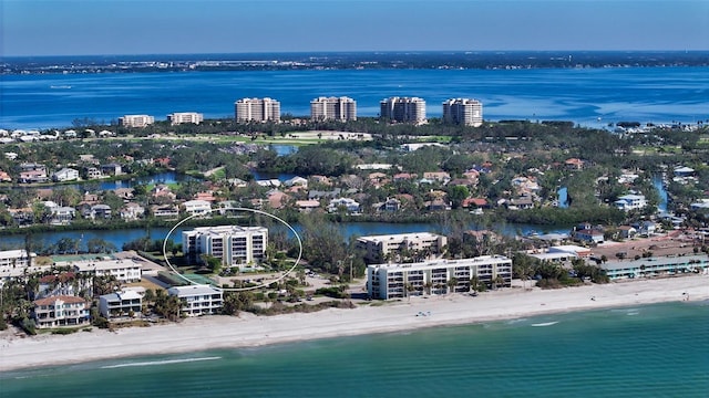 aerial view featuring a view of the beach and a water view