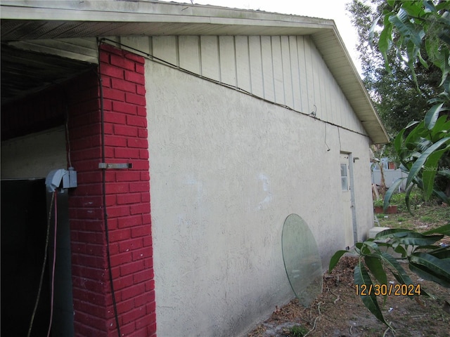 1814 6th Ave E, Bradenton, FL 34208 - view of side of home featuring brick siding and stucco siding
