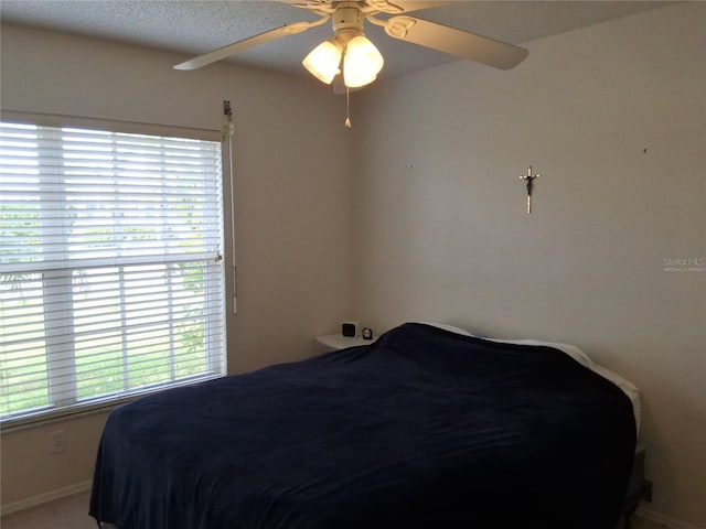 5115 44th St W, Bradenton, FL 34210 - bedroom featuring baseboards, a ceiling fan, and carpet