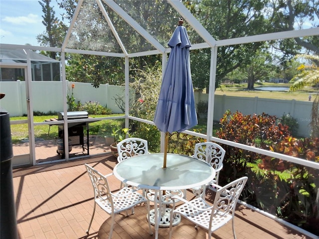 5115 44th St W, Bradenton, FL 34210 - sunroom with outdoor dining area and a water view