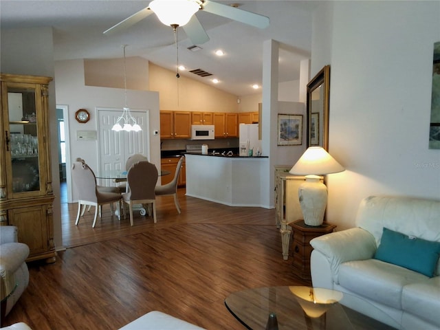 5115 44th St W, Bradenton, FL 34210 - living area featuring high vaulted ceiling, dark wood finished floors, and visible vents
